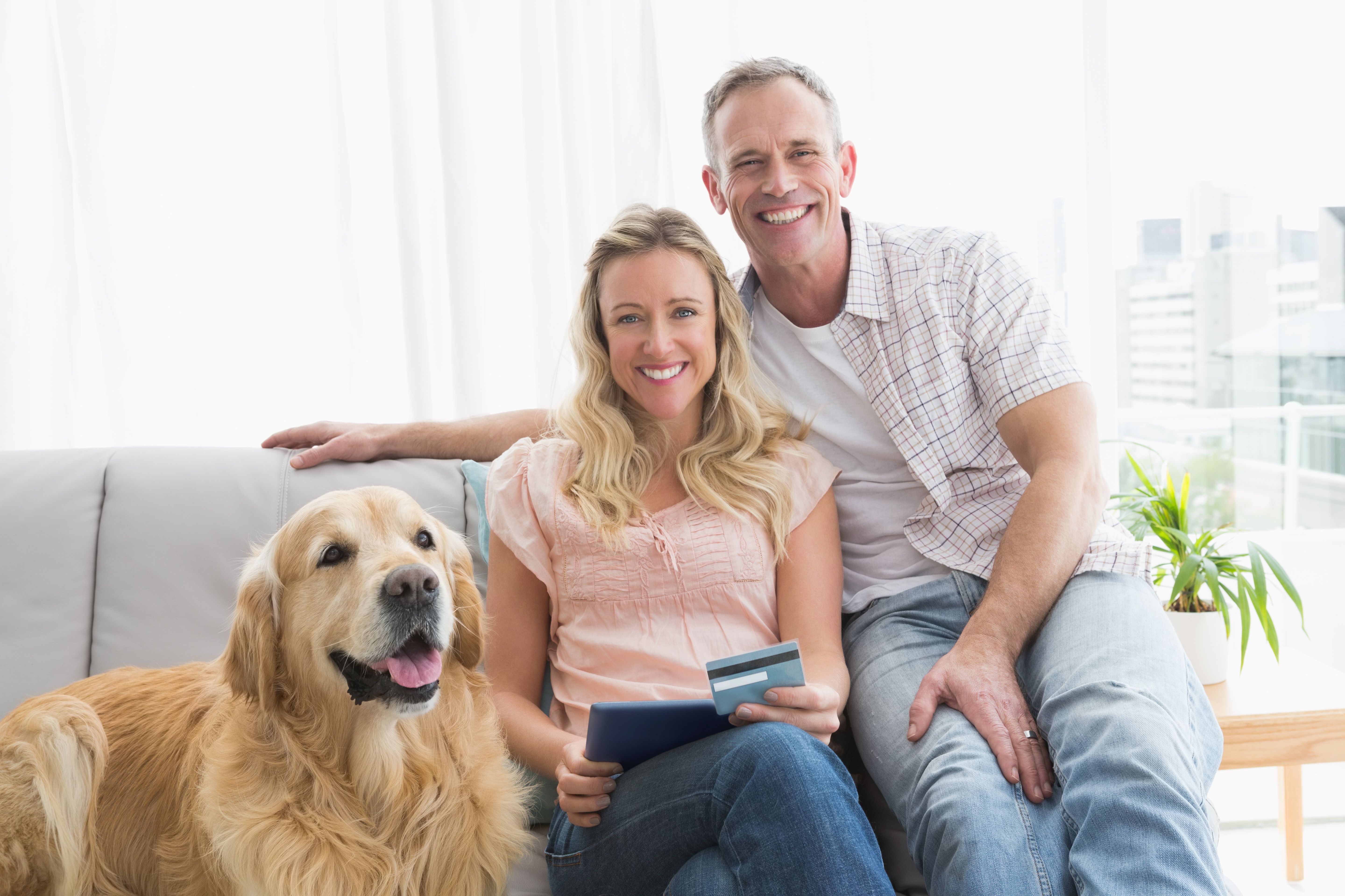 family and dog at computer